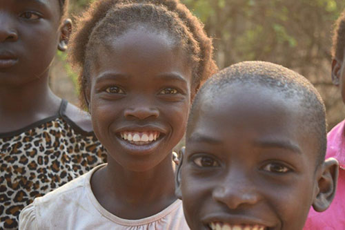 orphans greet volunteers